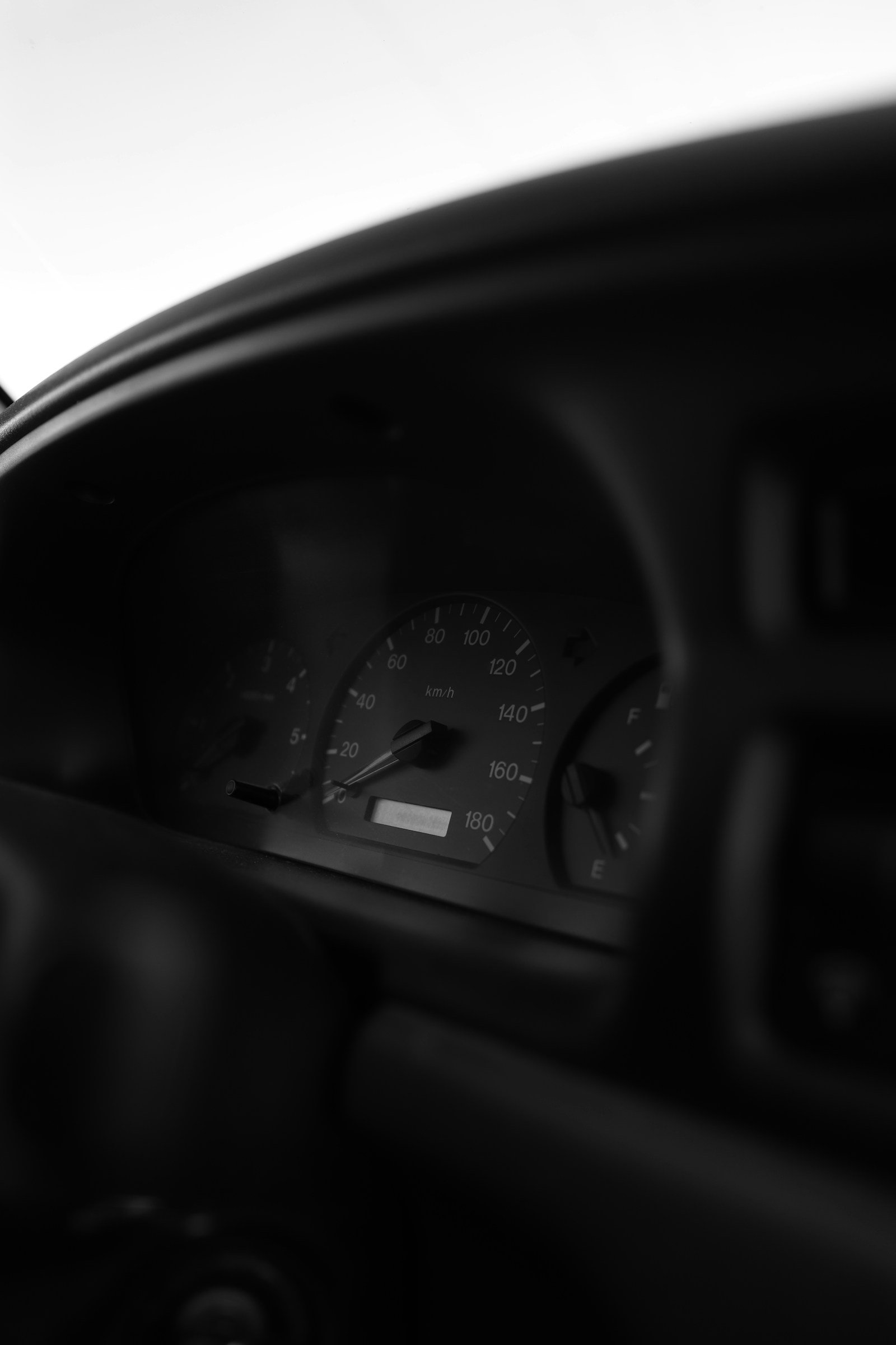 A vehicle dashboard, where the mileage is read on return