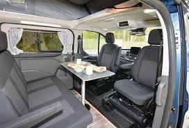 The lounge with swivelled cab seats around the table